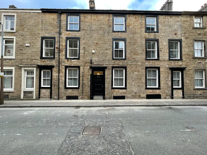 Yorkshire stone terrace by Home Hues: window frames and entrance door freshly painted in heritage black